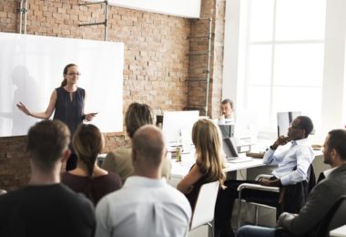 employee training. woman presenting to group of employees