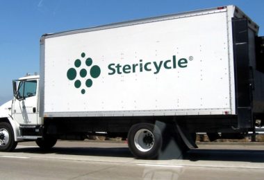 Stericycle logo on side of white large truck